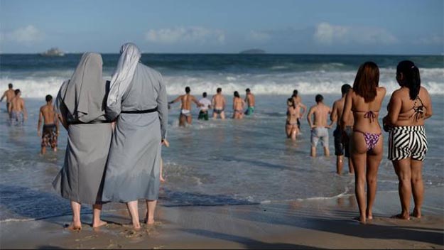 Nun at a beach