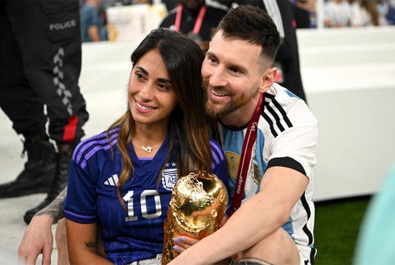 Messi and his wife with FIFA World Cup Winner's Trophy